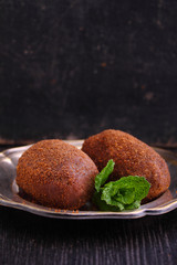 potato cake on the plate on a black background. Russian kitchen.