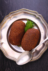 potato cake on the plate on a black background. Russian kitchen.