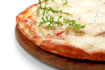 Pizza full of cheese on wooden board isolated on white background, close up