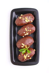 potato cake in a black plate on a white background. Russian kitchen