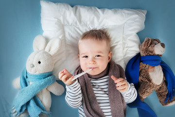 Ill boy lying in bed