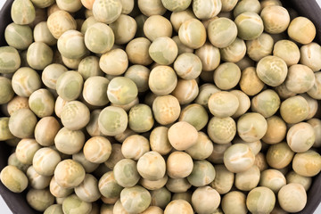 peas in a black plate