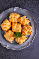 eclair cake in a plate on a black background