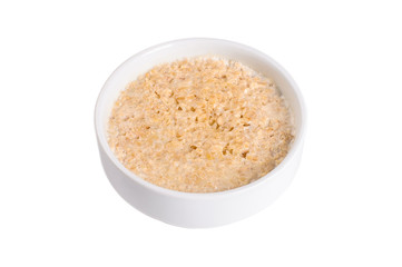 Bowl of oats porridge isolated on a white background. Healthy breakfast