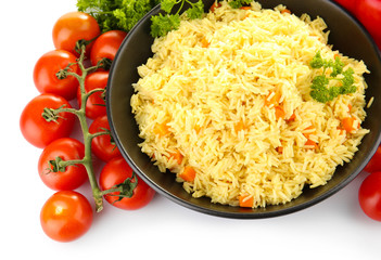 Dish of rice with vegetables isolated on white