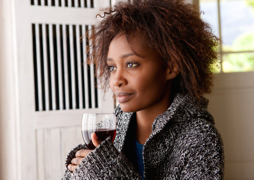 Beautiful African Woman Holding Glass Of Wine