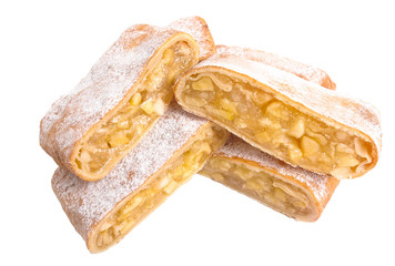 A piece of apple strudel sprinkled with powdered sugar. Isolated on white