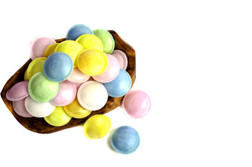 Fototapeta na wymiar Colorful candy in wooden dish.