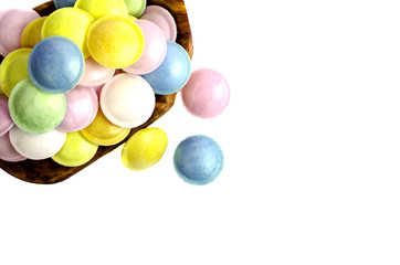 Fototapeta na wymiar Colorful candy in wooden dish.