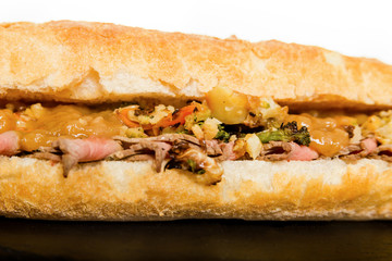 Close Up of Italian Sub Long Baguette with Ham Cheese Tomato and