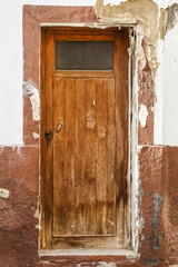 Ancient closed  wooden door.  Spain.