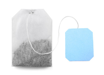 Teabag with blue label isolated on white background © Africa Studio
