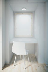 Small white office with blank frame on wall