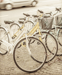 Fototapeta na wymiar Bikes parked on the pavement. Vintage effect.