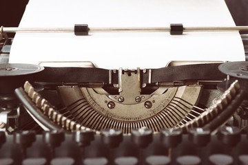 Obraz na płótnie Canvas Old typewriter with paper, close up