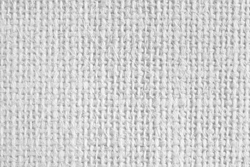 Background from gray coarse canvas texture.