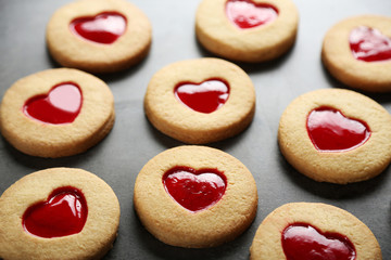 Assortment of love cookies on grey background