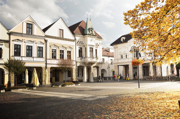 Historical town square in autumn early morning in sunshine (Zilina, Slovakia)