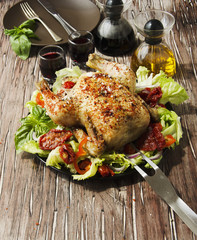 baked chicken with herbs spices ingredients, selective focus