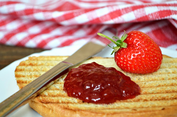 Fresh strawberry and strawberry jam on toast