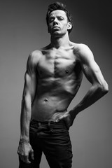 Obraz na płótnie Canvas Skinny young man posing fashion, slim body