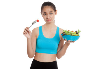 Unhappy Asian healthy girl eat salad