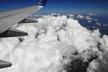 Naklejka na ściany i meble White clouds from airplane window