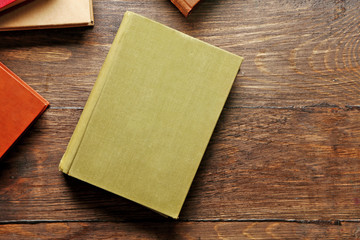 Obraz premium Pile of books on wooden background