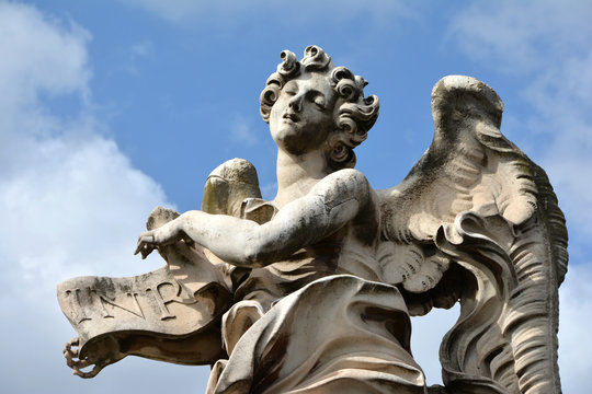 Angel in ectasy with INRI sign from Ponte Sant'Angelo, in Rome