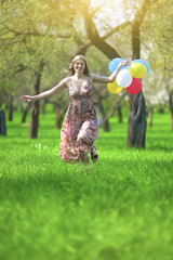 Fototapeta premium Modern Lifestyle Concept. Young Caucasian Blond Female with Bunch of Balloons