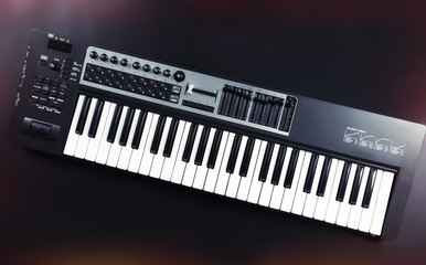 Fototapeta premium Keyboard of synthesizer on black background