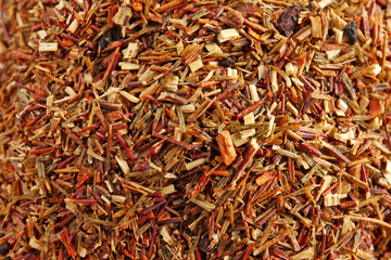 Dry tea with berries on background