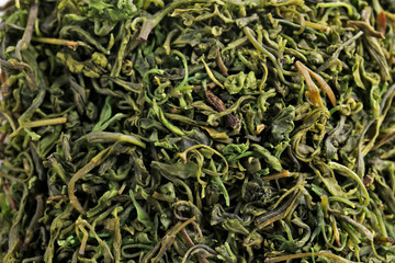 Green dry tea on background