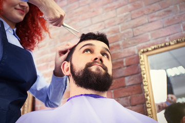 Handsome man visit barber shop