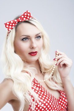 Pinup Style and Concepts. Sexy Sensual Caucasian Blond Woman in Pin up Dress