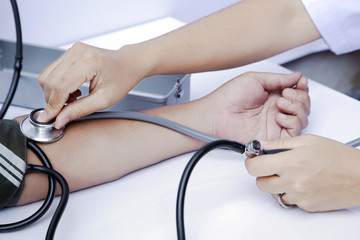Blood donation, Asian male blood donor measuring blood pressure by mercury sphygmonometer