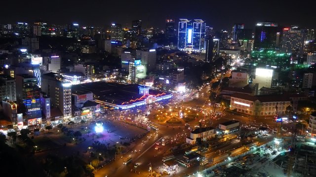 Impression, colorful, vibrant scene of traffic, dynamic, crowded city with trail on street, Quach Thi Trang roundabout at Ben Thanh market, Ho Chi Minh city (Sai Gon), Vietnam
