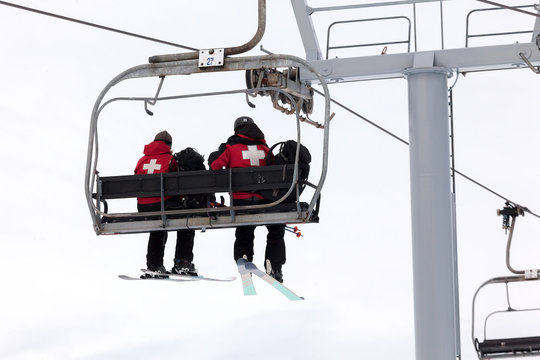 US Forest Medical Rescue Crew Riding Ski Lift