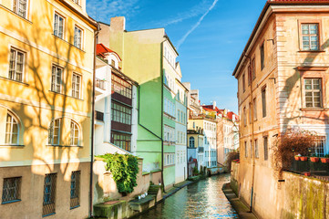 Fototapeta na wymiar Colorful houses on the water channel in Prague, Czech Republic.