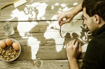 Drawing maps of the world with flour
