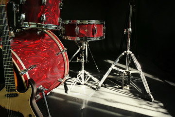 Fototapeta na wymiar Musical instruments on a stage on dark background