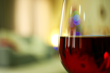 Glass of red wine on blurred background