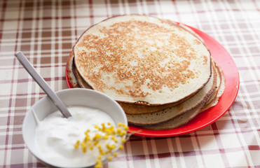 stack of pancakes on   red plate