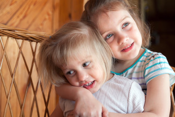  little sisters hugging