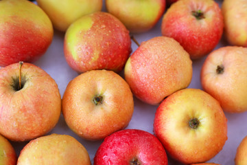 Background with fresh delicious juicy red apples. Delicious colo