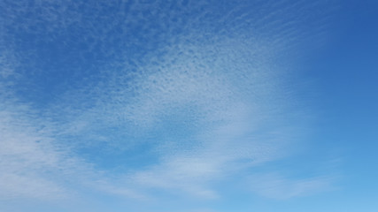 White cloudy and blue background