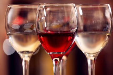 Glasses of red and white wine closeup