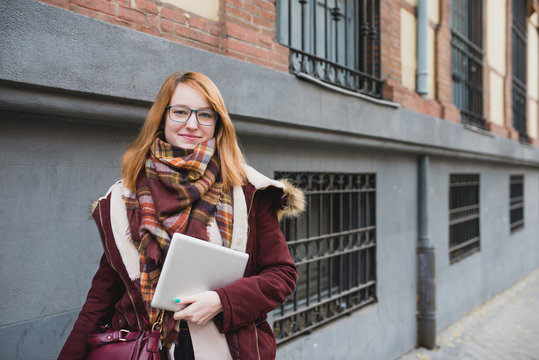 Portrait of smiling red-haired woman