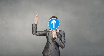 Woman applying card to face