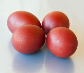 Four Easter eggs  against silver background